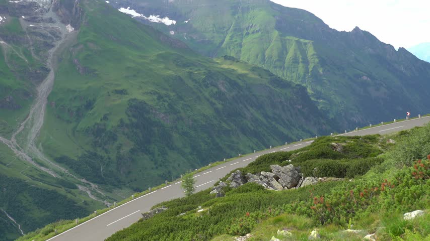 Car Driving Along the Scenic Grossglockner High Alpine Road in Austria