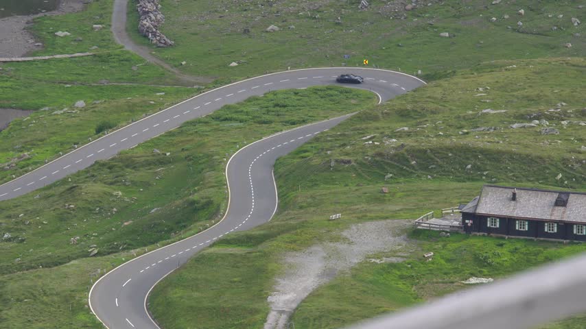 Sports Car Driving Along the Scenic Grossglockner High Alpine Road in Austria