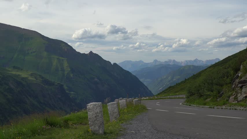 Car Driving Along the Scenic Grossglockner High Alpine Road in Austria