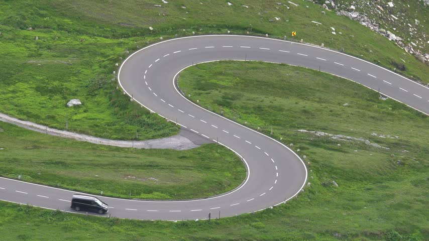 Car Driving Along the Scenic Grossglockner High Alpine Road in Austria