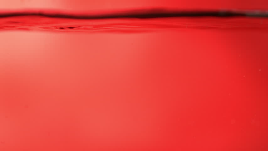 Super Slow Motion Shot of Fresh Strawberries Falling into Water at 1000fps.