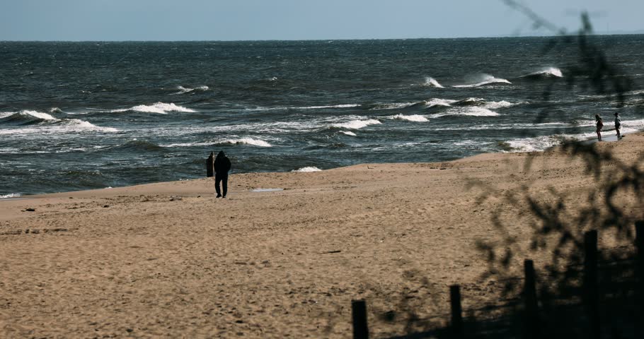 Poland, Stegna - 06-05-2026: People resting on a beach of Baltic Sea.