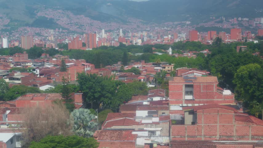 High angle view of medellin, colombia, with its characteristic brick buildings and mountains