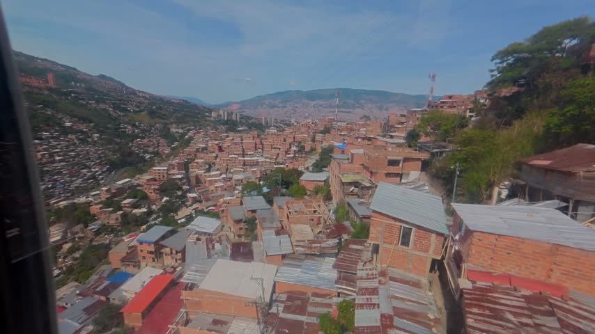 Scenic view of the medellin cityscape and hillside favelas from the metrocable public transit system