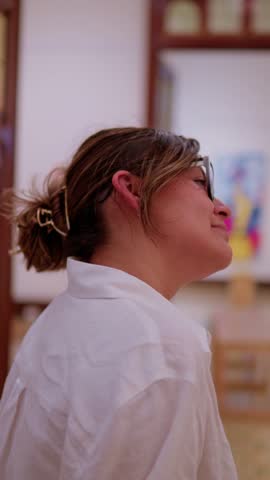 Young female tourist appreciating art and culture inside the museum of antioquia in medellin, colombia