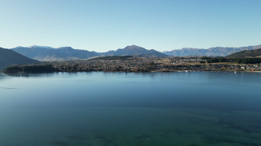 New Zealand Lake Wanaka landscape offers spectacular mountain scenery with Southern Alps peaks and beautiful natural ranges surrounded by peaceful Pacific island wilderness for tourism