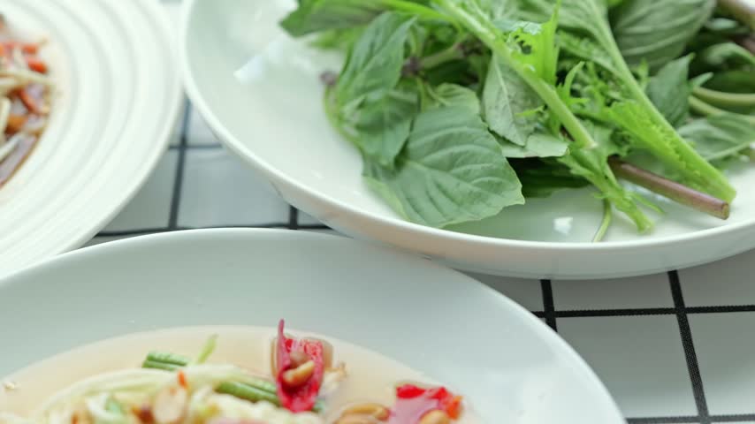 Green Papaya Salad with Tomato, Bean Sprout, Peanut, Chili, Fresh Herbs, and Asian Noodles