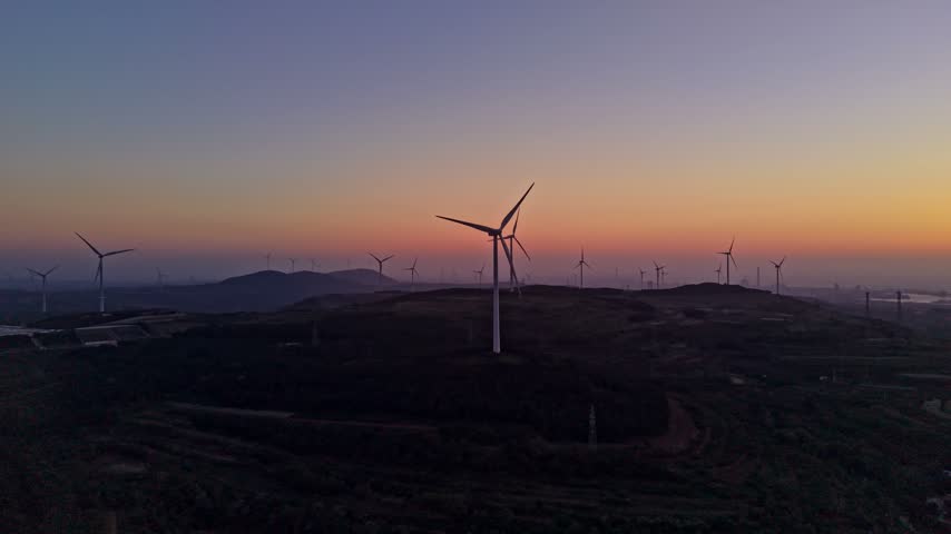 Wind Turbines on Hillside at Dusk, Coastal Wind‑Farm Sunset Landscape	
