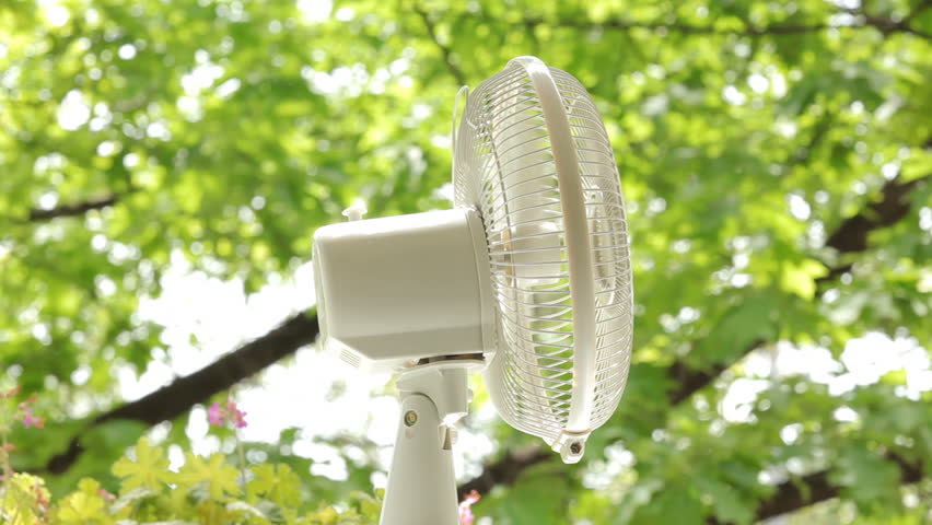 Electric fan on nature background