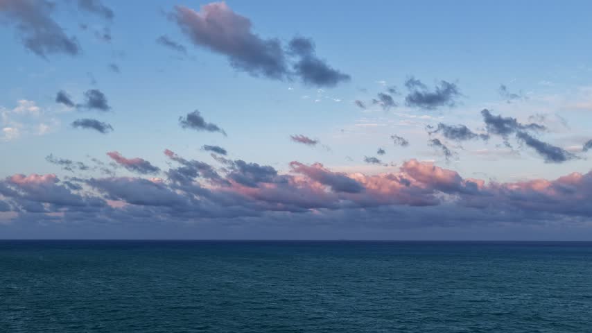 Horizon sunrise sky hyperlapse. Sunrise seascape. Hyperlapse summer seascape. Sea cloudscape horizon hyperlapse. Sunset cloudy sky. Skyscape at summer vacation. Skyscape with sea sunset footage