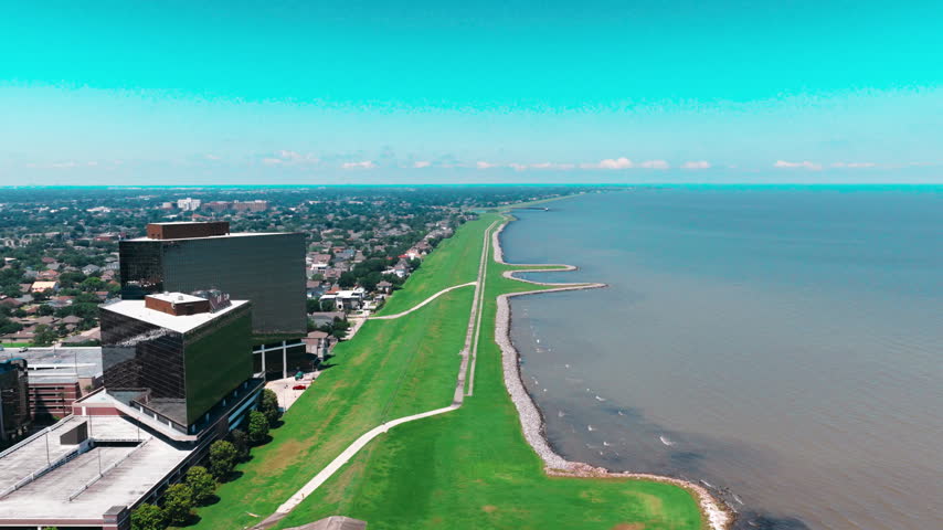 Metairie Louisiana aerial drone flight over Jefferson Parish, a New Orleans suburb on the south shore of Lake Pontchartrain with levee, canal, park and waterfront homes.