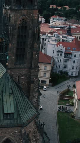 Aerial shot of the Gothic Cathedral of St. Peter and Paul and surrounding city rooftops in Brno, Czech Republic.