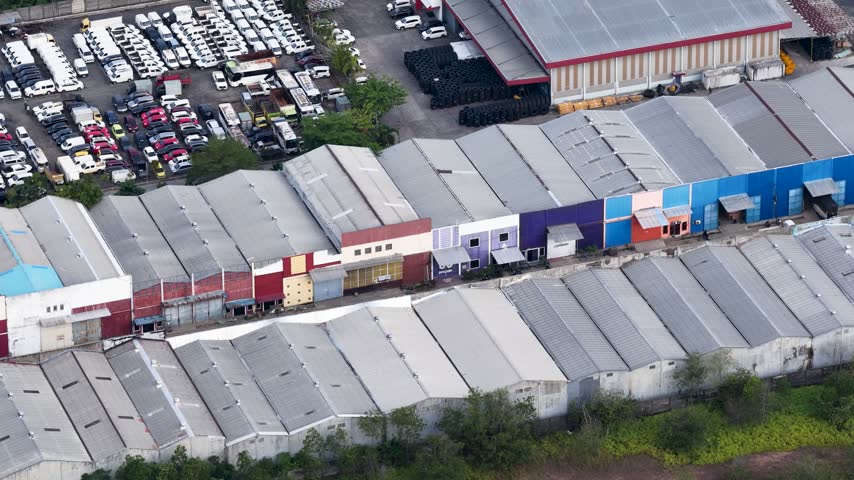 Industrial buildings and parked cars in South Kalimantan, Indonesia.