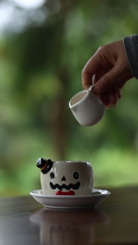 Creative Halloween Coffee with Ghost Shaped Cup and Milk Pouring