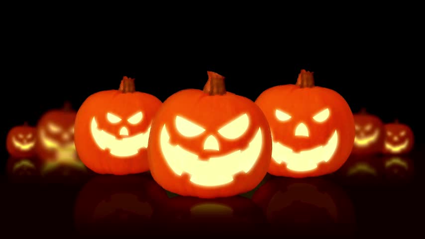 Glowing Halloween Pumpkins On Black