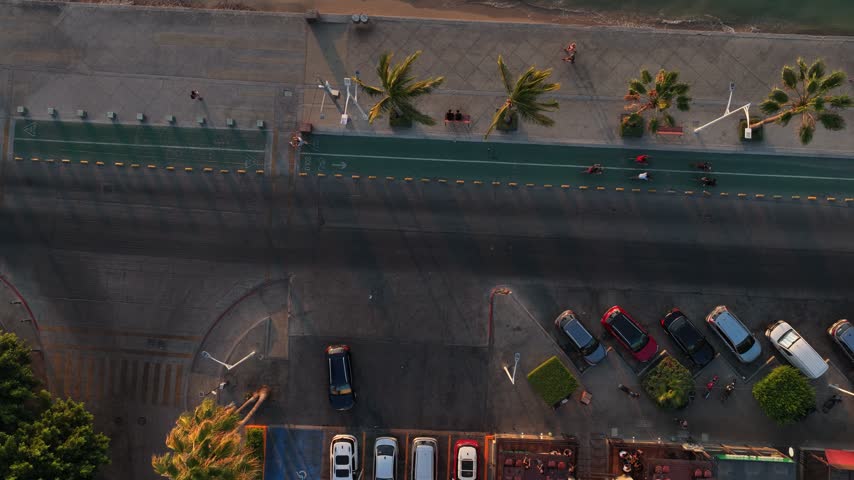 Aerial top down view of the Malecon boardwalk in La Paz at golden hour