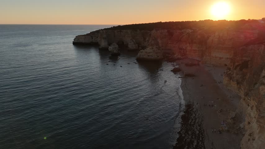 Sunset over stunning cliffs and arches Algarve, Portugal 
