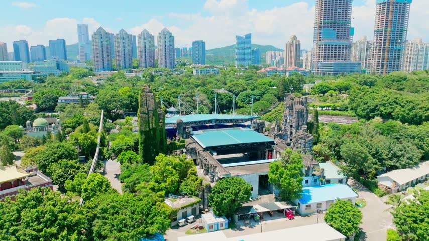 Aerial view of outdoor theater and artificial rock formations in Shenzhen, Guangdong, China. The scene features Splendid China. Relevant to tourism and leisure infrastructure.