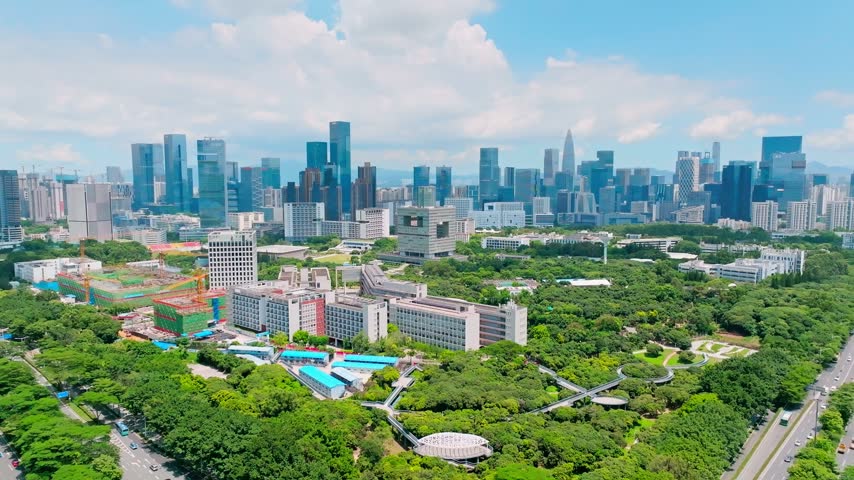 Aerial view of academic buildings with a square opening facade in Shenzhen, Guangdong, China. The scene features Shenzhen University. Relevant to higher education and campus planning.