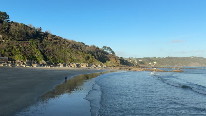 Holiday or vacation spot in Cornwall looking down the river towards the town of Looe towards the sea and beach England UK 4K