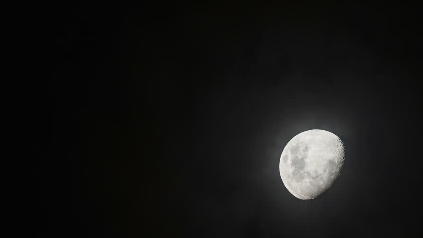 Timelapse of moon rising in the night sky