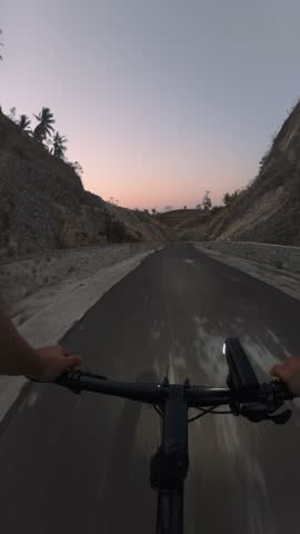 First Person View Cycling on Mountain Road at Sunset