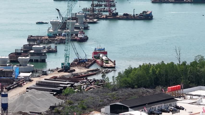 Fuel tanker truck unloading from a ferry at the harbor