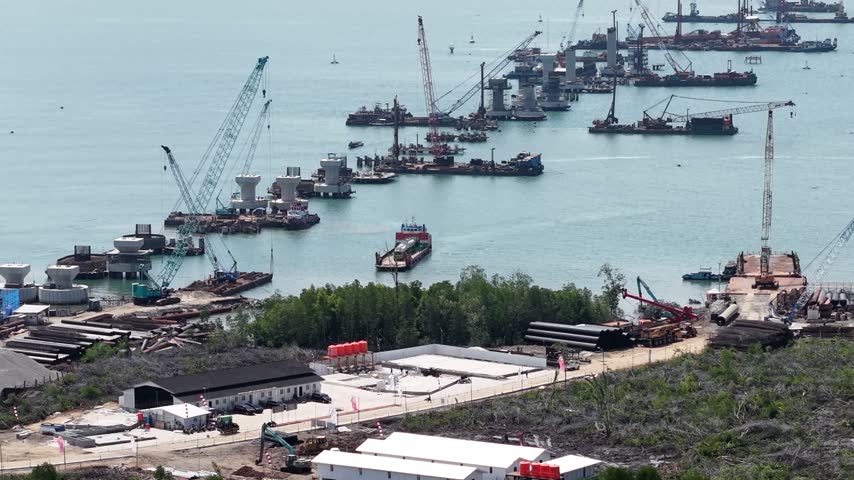 Fuel tanker truck unloading from a ferry at the harbor