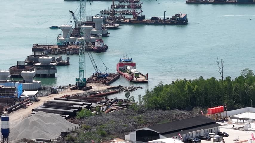 Fuel tanker truck unloading from a ferry at the harbor