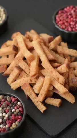 Croutons or crackers made from rye bread with garlic, salt, and spices. Croutons with salt