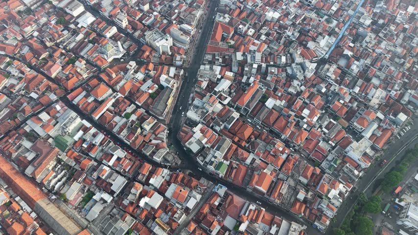 Aerial view of dense urban streets with red tiled rooftops at Surabaya old town