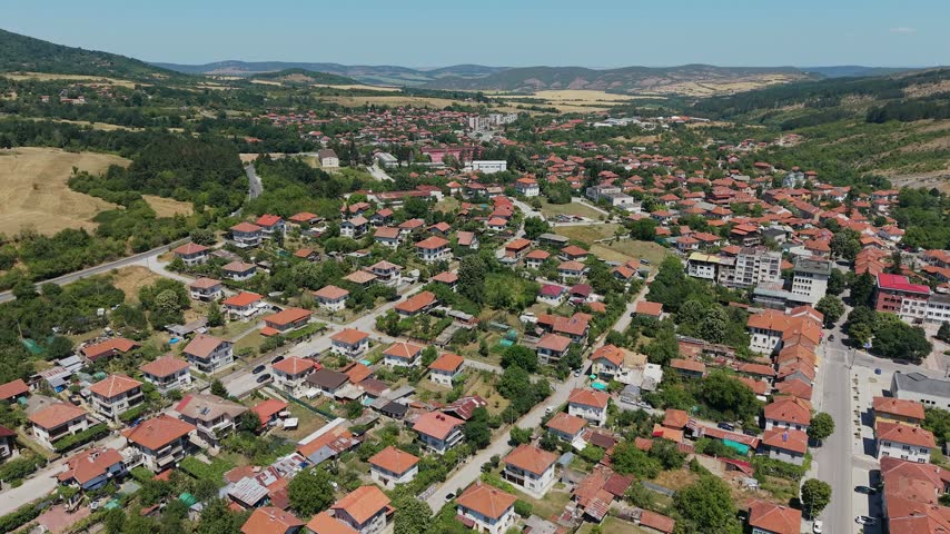 Geographical aerial view of Yablanitsa, Bulgaria, nestled in the valley with mountain backdrop.