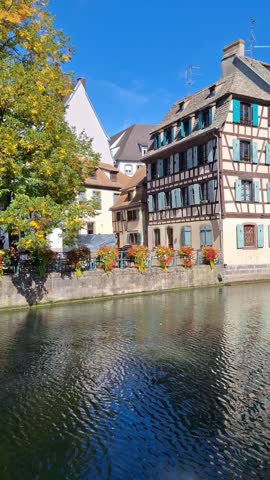 Canal and river III with colorful houses. Alsace.