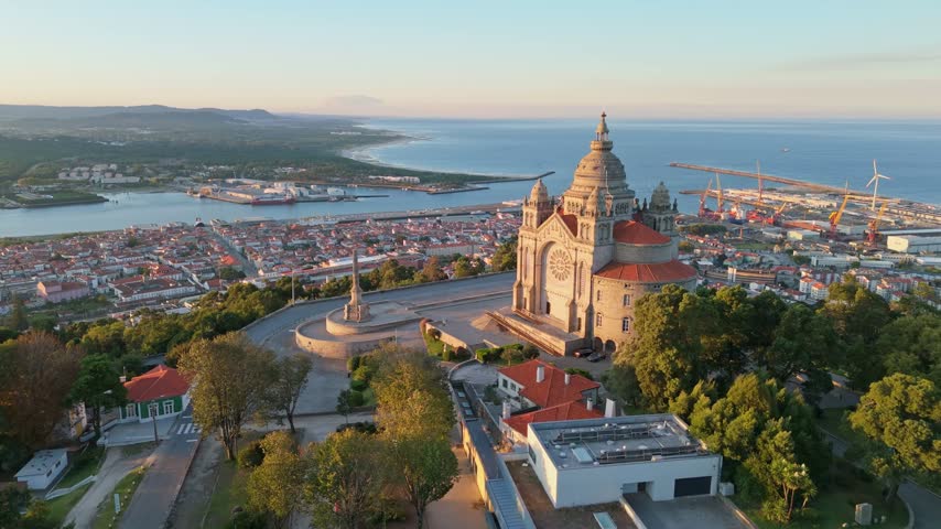 Drone view of the stone facade of Santa Luzia Sanctuary in Viana do Castelo, Portugal, at sunrise. Push in approach dolly shot