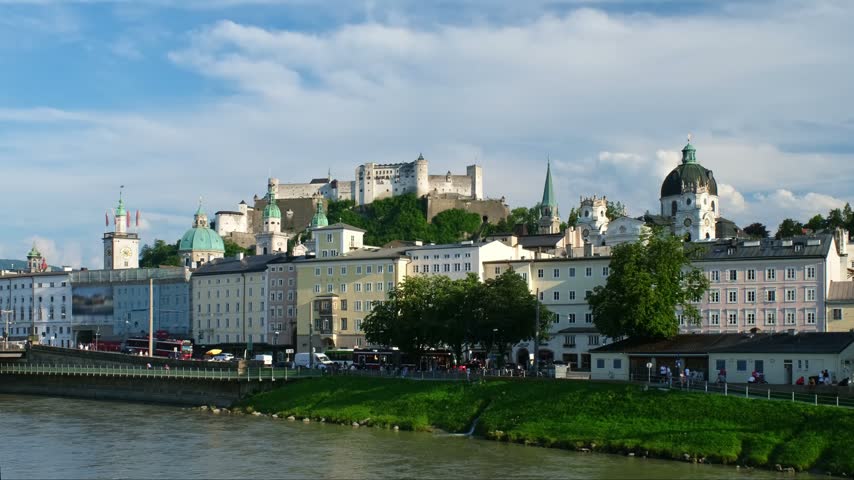 Salzburg skyline with the Salzach River in the foreground and Hohensalzburg Fortress in Austria