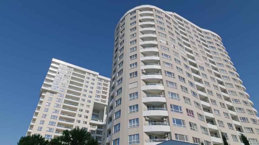 Modern high-rise glass office and residential buildings under clear blue sky in Burgas, Bulgaria