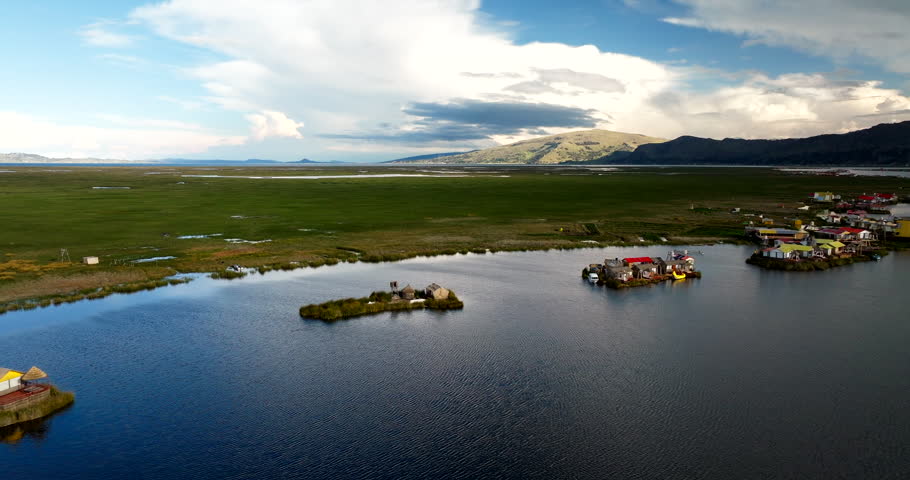 Aerial view of Uros floating islands on massive Lake Titicaca in Peru