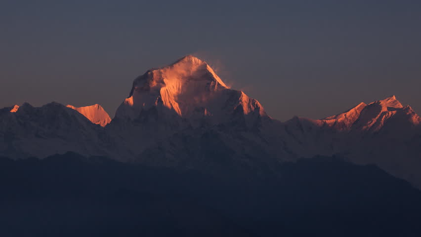 Snow avalanche falling from Dhaulagiri peak (8167 m) at sunrise. Time Lapse. Canon 5D Mk II. Royalty-Free Stock Footage #4187506