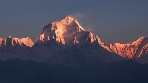 Snow avalanche falling from Dhaulagiri peak (8167 m) at sunrise. Time Lapse. Canon 5D Mk II.