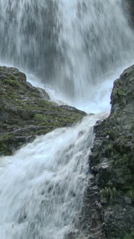 Water Falling Over Wet Rock Close Up Vertical Video