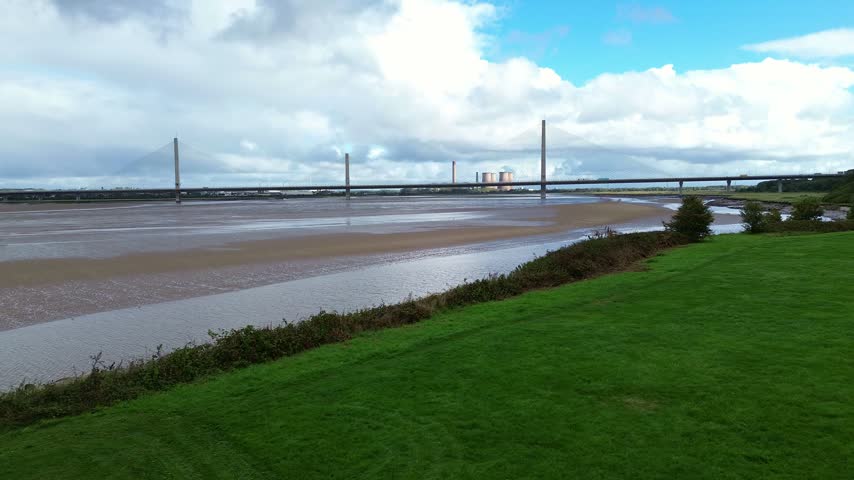 Mersey gateway bridge aerial view across Wigg island Mersey river at low tide