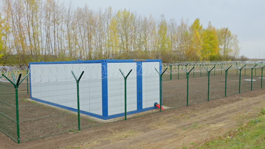 Compact electrical substation stands on prepared industrial site. Modern facility supports safe power distribution and grid reliability