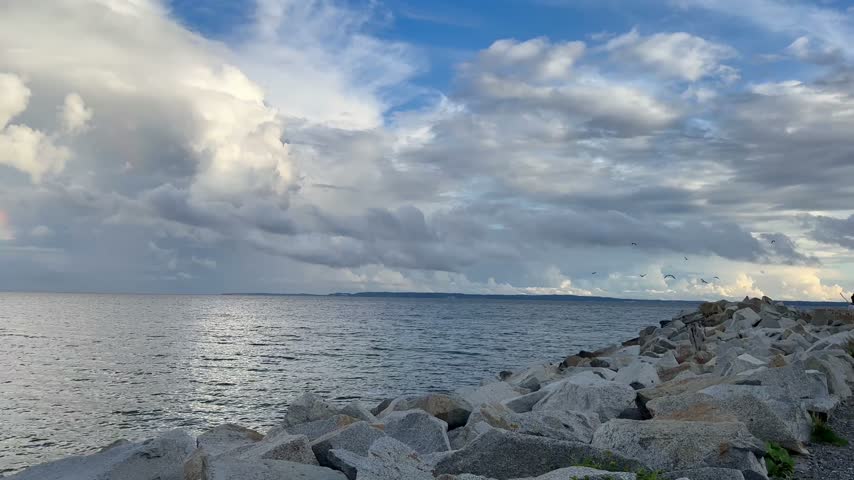 A rainbow in the clouds over the sea