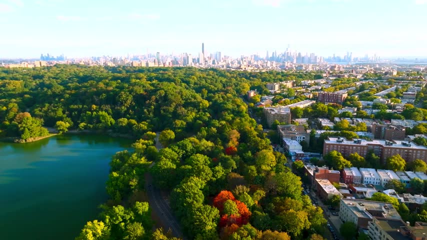 High-angle, daytime wide shot looking north over Prospect Park in Brooklyn. The footage captures the park