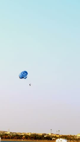Active parasailing over the sea. one of the types of outdoor activities, entertainment for tourists in the summer at the sea.