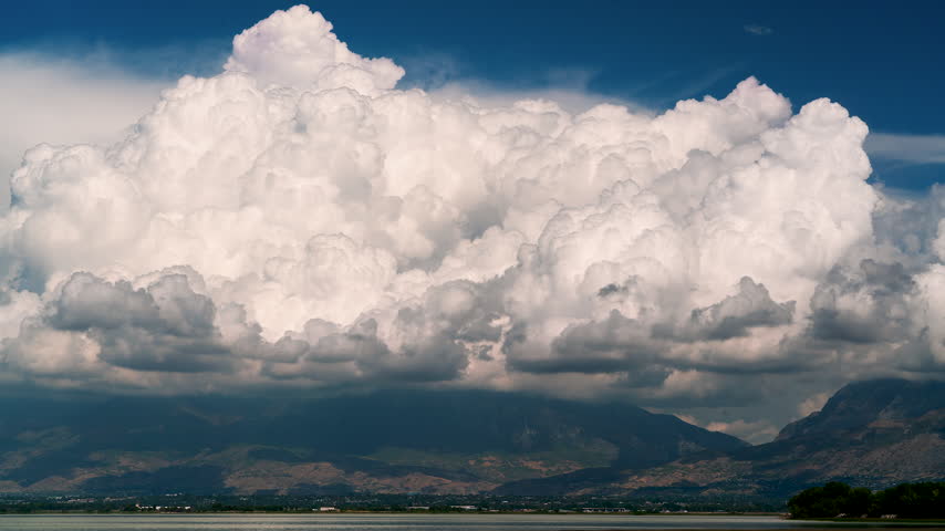 Time lapse of clouds moving over Timpanogos Mountain looking from across Utah lake.