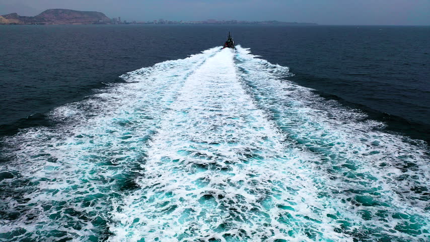 Aerial view of a fast coast guard of the Spanish Customs training and sailing in the Mediterranean Sea.