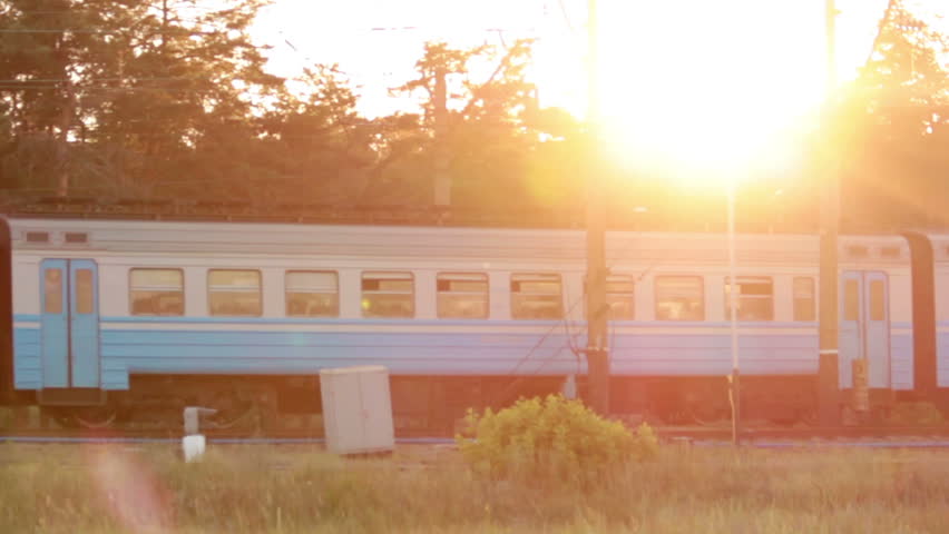 Train at sunset with cool sun beams. Good travel on summer vacation concept