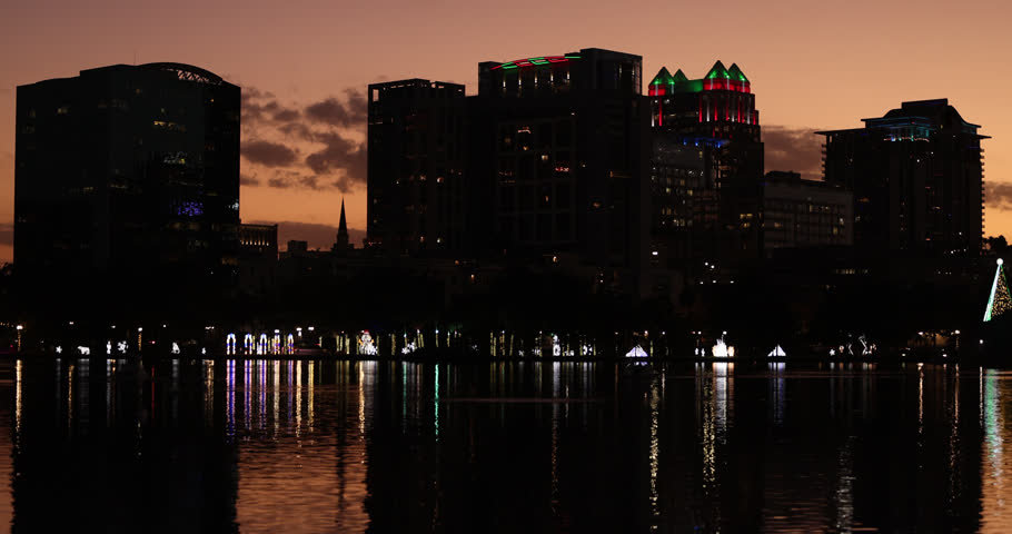 Night time view of the downtown Orlando, Florida, USA, skyline at night during the holiday months.