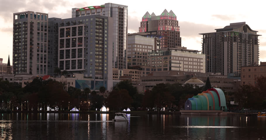 Sunset view of the downtown skyline and Lake Eola of Orlando, Florida, USA.